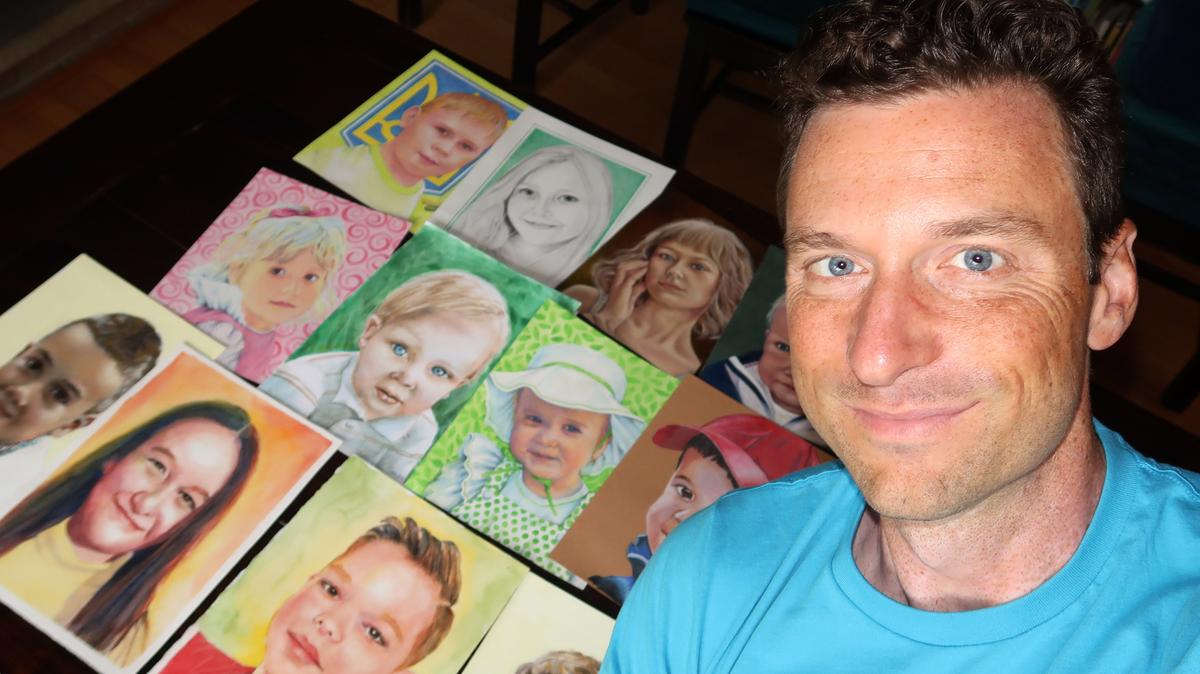 Бен с портретами украинских детей