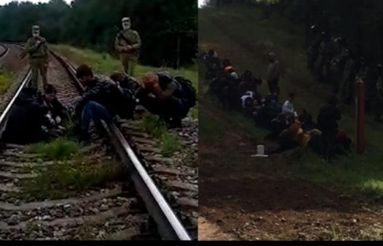 Армия Латвии показала видео, на котором вооруженные люди сопровождают мигрантов к границе